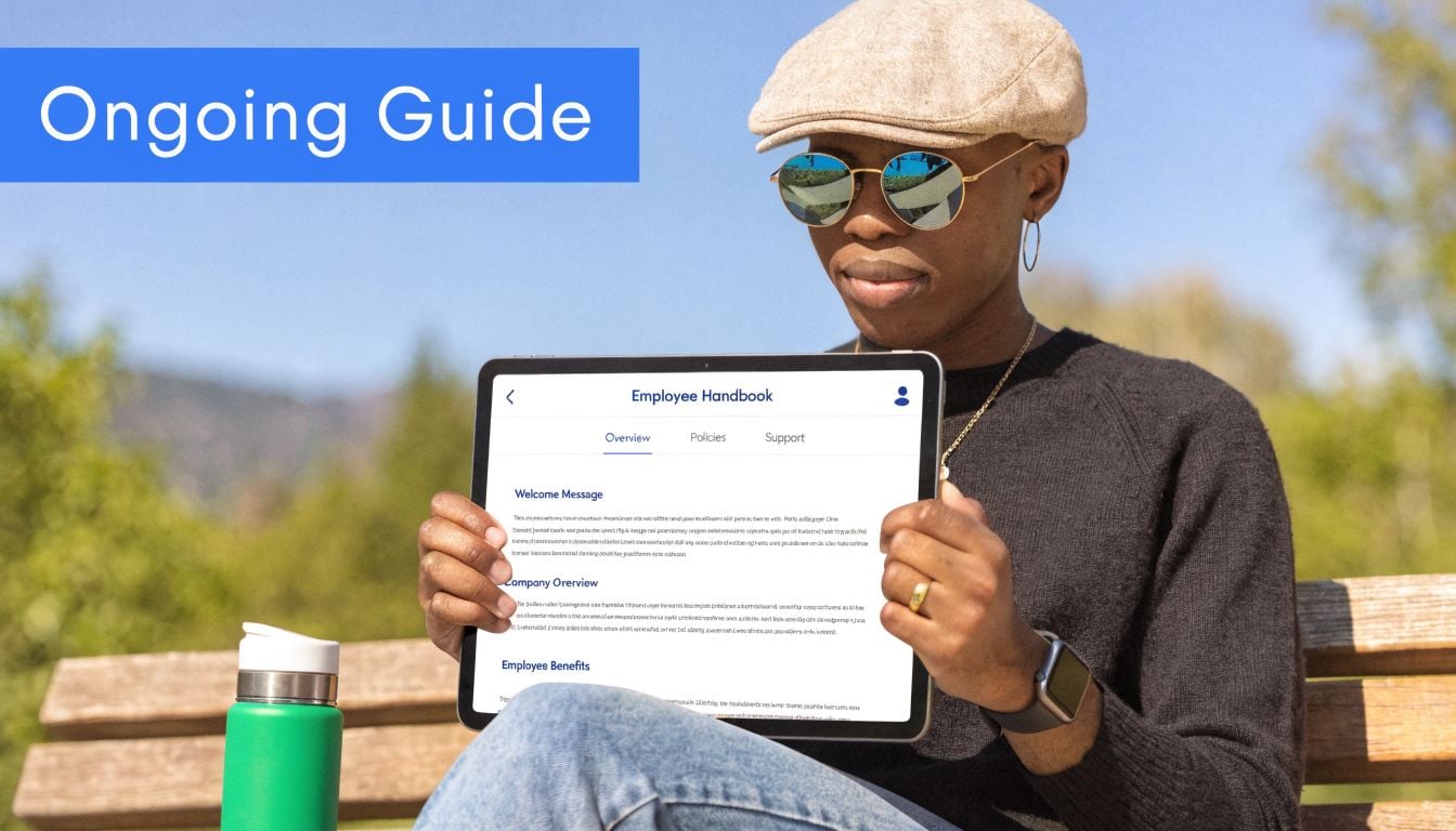 A person sitting outdoors on a wooden bench, holding a tablet displaying an employee handbook interface.