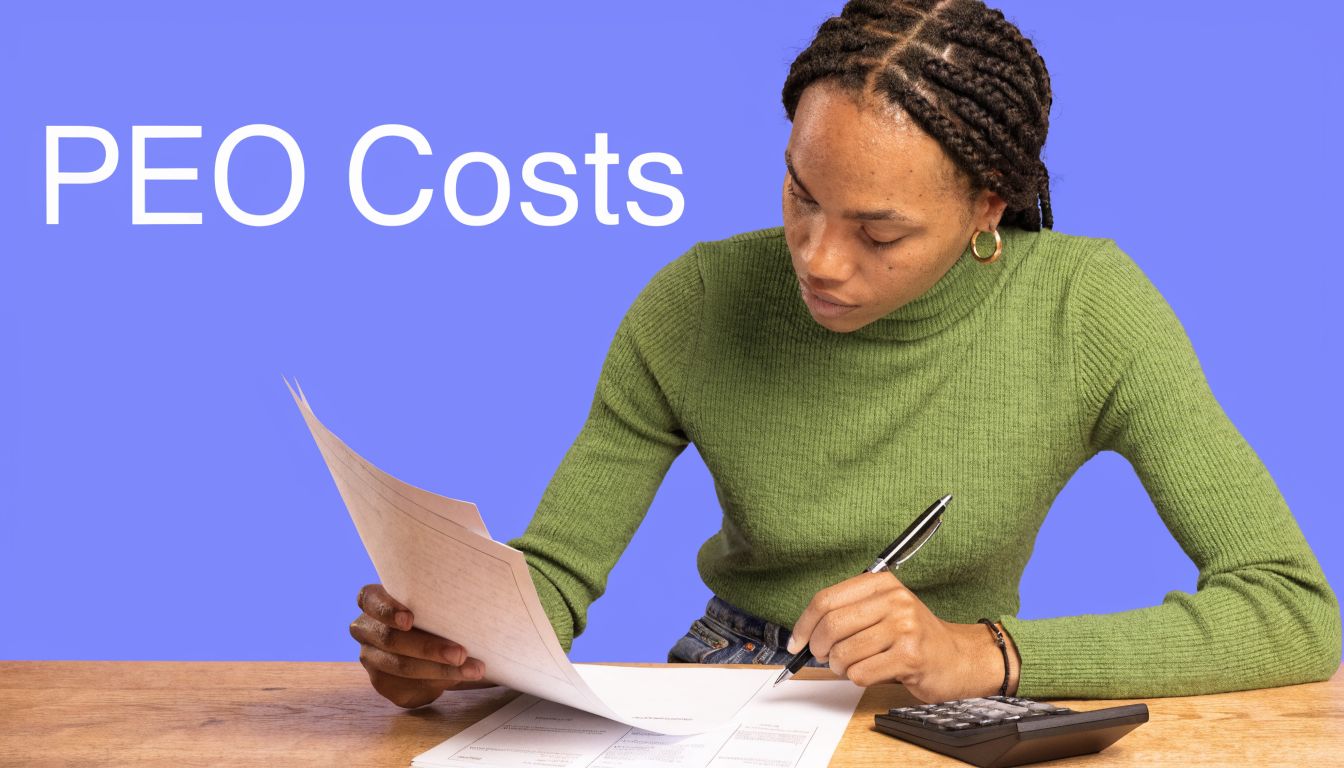 A woman in a green sweater reviewing financial documents at a wooden desk to calculate PEO costs.